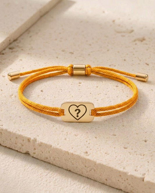 The Complicated status bracelet, golden cord, gold tag